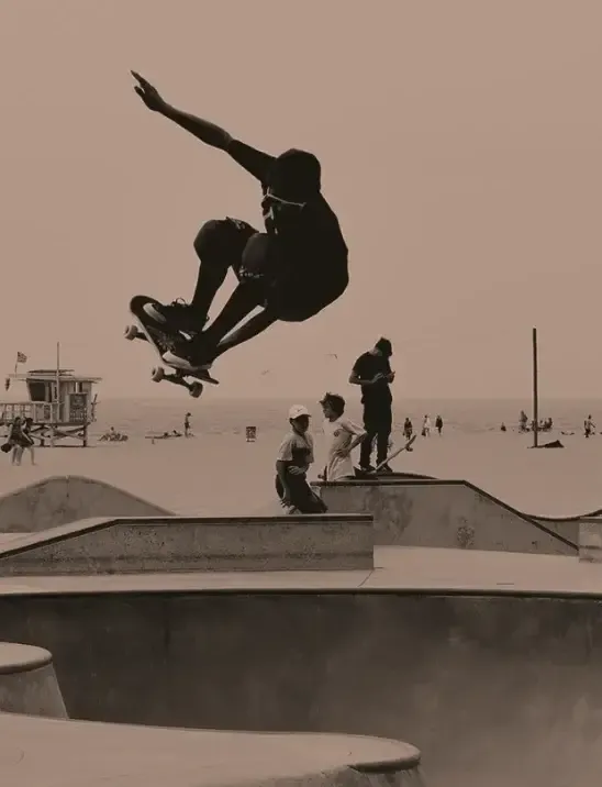 A member of the hellonativo team mid-air at the skate park in Venice Beach