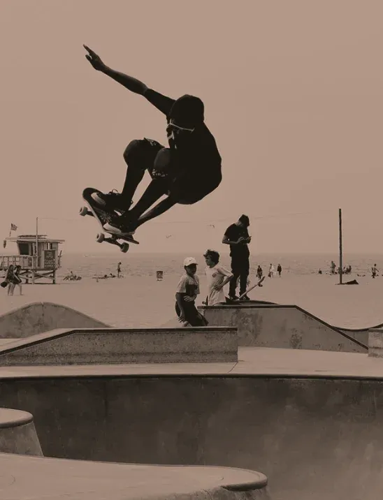 A member of the hellonativo team mid-air at the skate park in Venice Beach